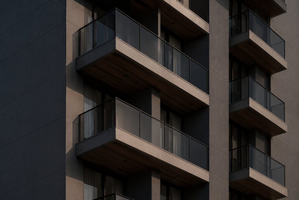 Detalhe da fachada de um edifício residencial com sacadas, ilustrando a dívida de condomínio ligada à unidade